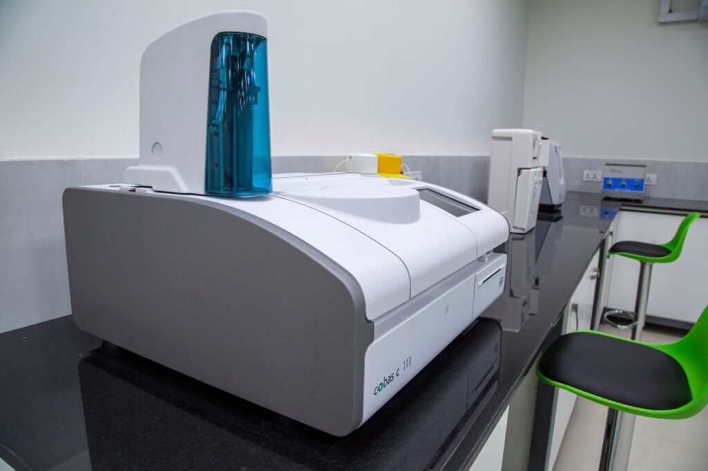 Sleek, Modern Laboratory Equipment On A Black Countertop In A Professional Lab Setting.